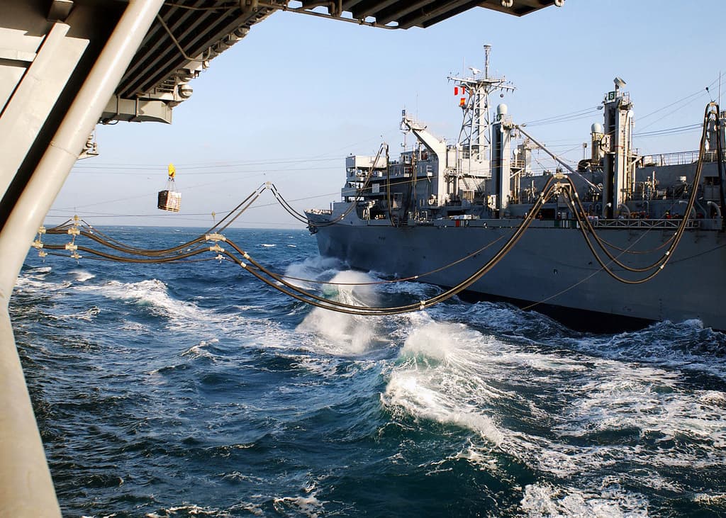 Naval replenishment-at-sea station alongside a support vessel at sea
